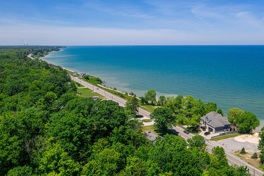 Ashtabula, OH - Aerial View of Lake Erie Coastline in Ashtabula, Ohio Displaying Ocean Trees and the Ocean